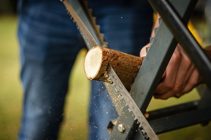 A man sawing wood