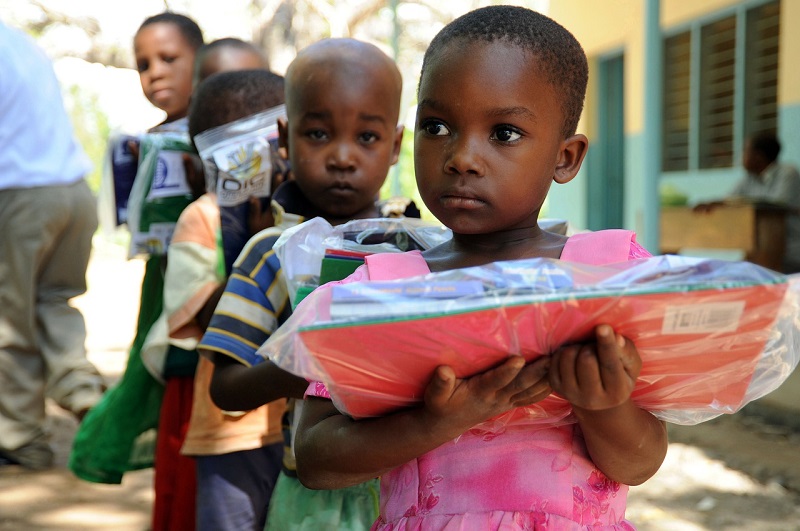 Little children holding books